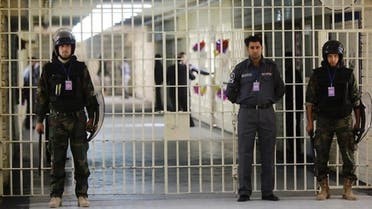 Guards stand at a cell block at the renovated Abu Ghraib prison in Baghdad, Iraq on Feb 21, 2009. (Photo courtesy: AP)