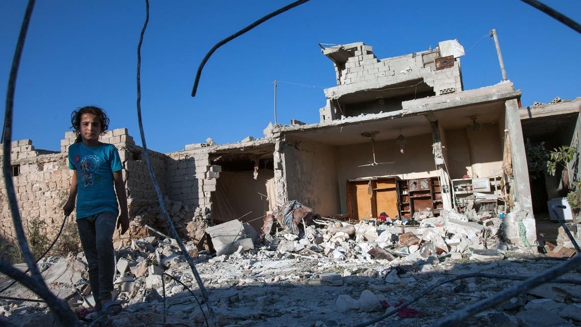A Syrian girl walks next to the debris of her house in the northwestern Syrian province of Idlib, the same region Polish reporter Marcin Suder was abducted from. (File Photo: AFP)