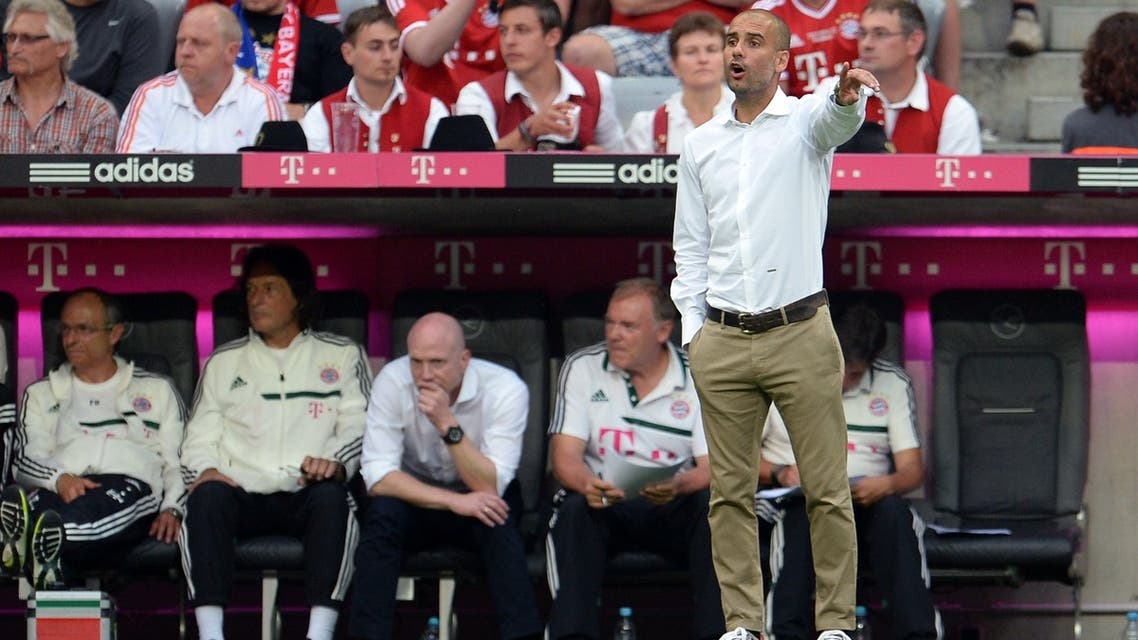 Bayern Munich's Spanish head coach Pep Guardiola gestures during the "Uli Hoeness Cup" friendly football match FC Bayern Munich vs FC Barcelona in the stadium in Munich, southern Germany, on July 24, 2013. AFP PHOTO