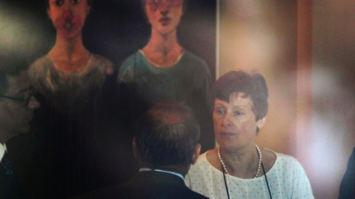 Angela Kane (R) head of the U.N. Office of Disarmament Affairs, chats with U.N. staff as she arrives in Damascus July 24, 2013.