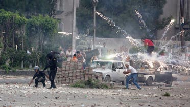 Fireworks are set off near police and anti-Mursi protesters by supporters of deposed Egyptian President Mohamed Mursi during clashes in Nasr city area, east of Cairo July 27, 2013. (Reuters)