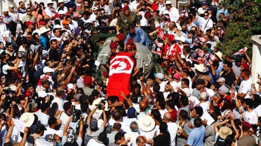 Mourners carry the coffin of slain opposition leader Mohamed Brahmi during his funeral procession towards the nearby cemetery of El-Jellaz, where he is to be buried, in Tunis July 27, 2013. (Reuters)