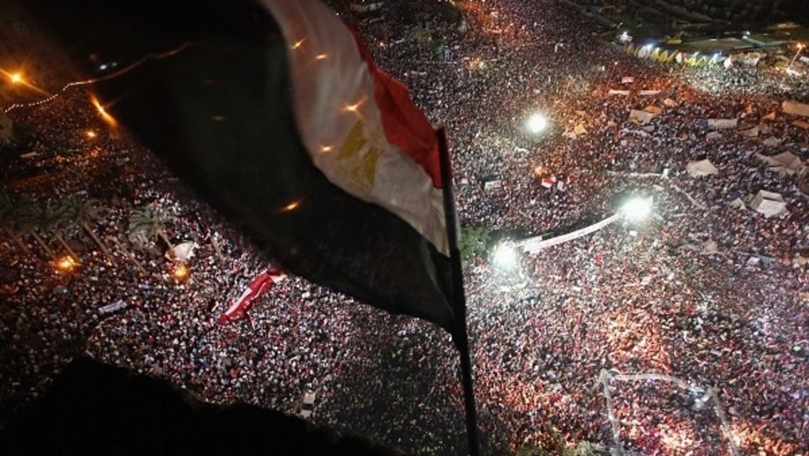 Anti-Mursi protesters chant slogans during a mass protest to support the army in Tahrir square in Cairo, July 26, 2013. (Reuters)