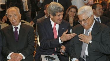Secretary of State John Kerry is joined by Israeli President Shimon Peres (L) and Palestinian President Mahmud Abbas at the King Hussein Convention Centre on May 26, 2013 (