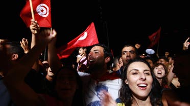People waving Tunisian flags gather during a protest to demand the ouster of the Islamist-dominated government, outside the Constituent Assembly headquarters in Tunis July 29, 2013. (Reuters)