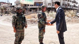 Assad visits troops in Damascus suburb, Syrian TV reports