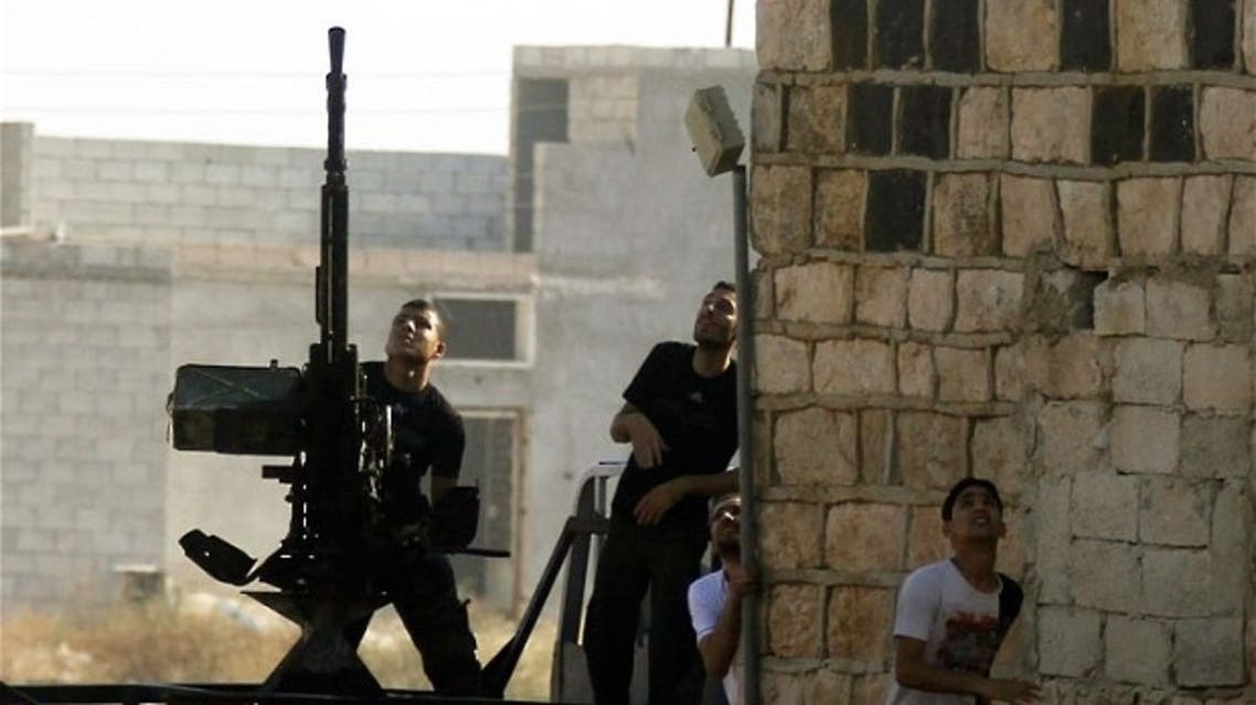 A Free Syrian Army fighter fires an anti-aircraft gun during an air strike in the village of Tel Rafat, some 37 km (23 miles) north of Aleppo. (File Photo: Reuters)