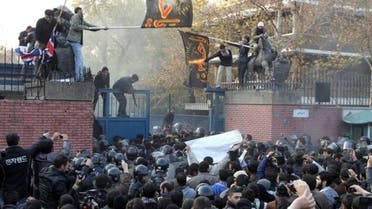 Iranian riot policemen try to prevent protesters from approaching the British embassy during a protest in Tehran on November 29, 2011. (File Photo: Reuters)