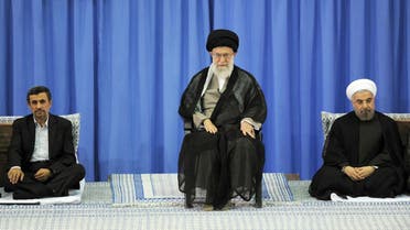 A handout picture released by the official website of the Iranian supreme leader Ayatollah Ali Khamenei on August 3, 2013, shows Khamenei (C) during a ceremony officially endorsing moderate cleric Hassan Rowhani (R) in the capital Tehran, as former president Mahmoud Ahmadinejad (L) sits by. AFP