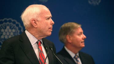 U.S. Senators John McCain and Lindsey Graham (R) talk during a news conference in Cairo, August 6, 2013. (Reuters)