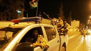 Members of the Libyan security forces drive through Benghazi in May 2013. (File photo: AFP)