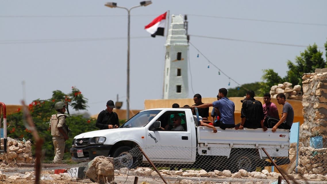 Egyptians ride a pick-up truck near the Kerem Shalom crossing, a zone where the Israeli, Egyptian and Gaza borders intersect. (File photo: Reuters)