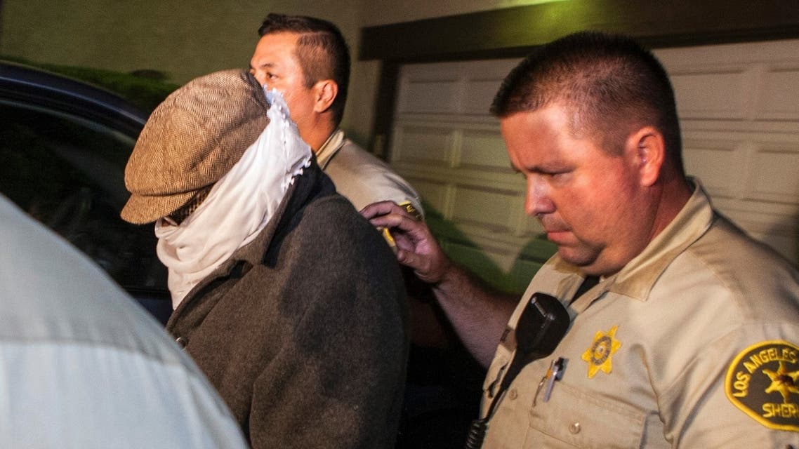 Mark Basseley Youssef, formerly known as Nakoula Basseley Nakoula, is escorted out of his home by officers in September 2012. (File photo: Reuters)