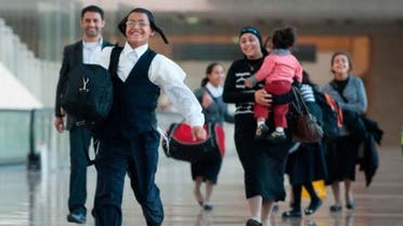 Yemeni Jews reunited with family memembers at Ben Gurion International Airport, August 14, 2013 (Photo Courtesy of Haaretz)