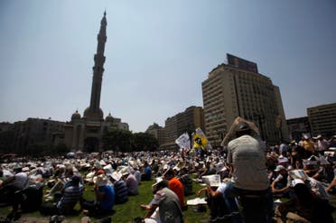 Members of the Muslim Brotherhood and supporters of ousted Egyptian President Mohamed Mursi attend Friday prayers at Ramses Square in Cairo August 16, 2013. (Reuters)
