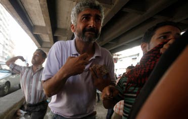 Members of the Muslim Brotherhood and supporters of ousted Egyptian President Mohamed Mursi take part in clashes in front of Azbkya police station in Ramses Square, Cairo August 16, 2013. (Reuters)