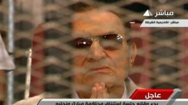 An image grab from Egyptian state TV shows Hosni Mubarak at a hearing at the police academy in Cairo on July 6, 2013 (Egyptian TV/AFP)