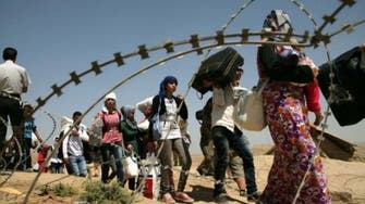 Hungry and scared, Syrian refugees flood Iraq