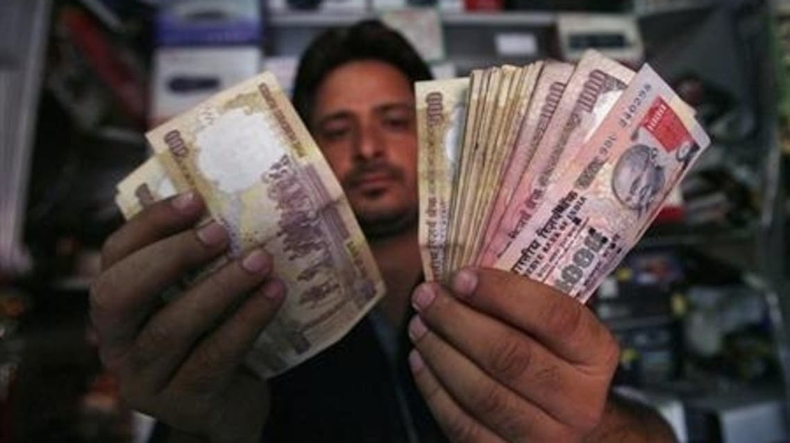 A shopkeeper counts Indian currency notes at his shop in Jammu (File Photo: Reuters)