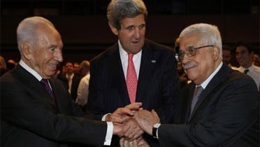 Secretary of State John Kerry (C) shakes hands with Israeli President Shimon Peres (L) and Palestinian President Mahmoud Abbas. (Reuters)