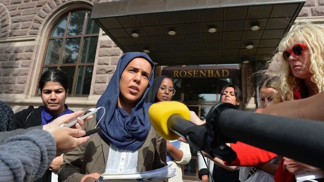 Fatima Doubakil, one of the initiator's of the "hijab outcry" campaign, speaks to the media outside the government building in Stockholm August 20, 2013 (Reuters)