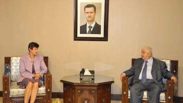 Syrian Foreign Minister Walid al-Muallem (R) meets U.N. High Representative for Disarmament Affairs Angela Kane in Damascus