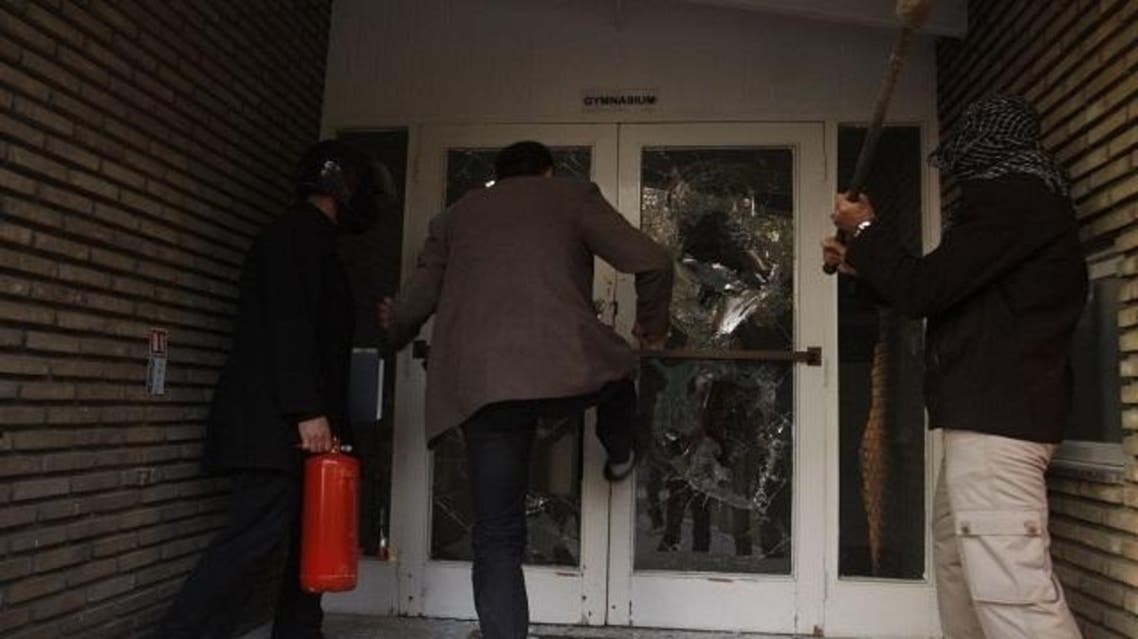 Protesters break through a door in the British embassy compound in Tehran. (File Photo: Reuters)