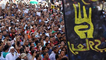 A flag of the "Rabaa" gesture, in reference to the police clearing of Rabaa Adawiya protest camp on August 14, is pictured during a protest by supporters of Muslim Brotherhood and ousted Egyptian President Mohamed Mursi in Cairo August 23, 2013. Reuters
