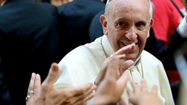 Pope Francis waves at the audience upon his arrival at the Church of Saint Augustine in downtown Rome on August 28, 2013. AFP