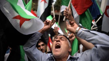 A Syrian immigrant living in Bulgaria shouts slogans against the regime of Syrian President Bashar Al-Assad on August 31, 2013, during a demonstration in front of the European commission building in Sofia. (AFP)