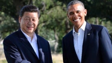 A file photo picture shows Chinese President Xi Jinping and U.S. President Barack Obama. (AFP)