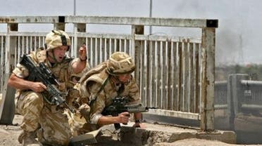 British soldiers secure the site where a military vehicle was destroyed in the southern city of Basra in 2006. (File photo: AFP)