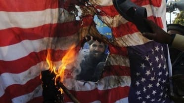 Pakistani protesters burn the U.S. flag at a protest rally in Lahore. (File photo: AFP)