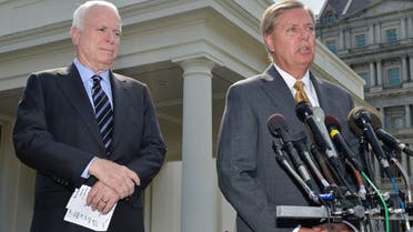 U.S. Senator Lindsey Graham (R-SC) (R) makes remarks to the media as U.S. Senator John McCain (R-AZ) (L) listens, after meeting with U.S. President Barack Obama at the White House. (rEUTERS)