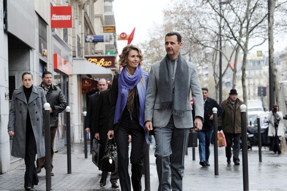 Asma Al-Assad with her husband in Paris in 2010. (File Photo: AFP)