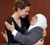 Asma al-Assad seen embracing an old woman. (Photo courtesy: Instagram)
