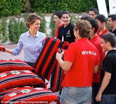 Asma al-Assad hands out supplies on July 24, 2013. (Photo courtesy: Instagram)