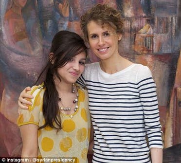 A photo opportunity for Syria's first lady and a young Syrian girl on Wednesday. (Photo courtesy: Instagram)
