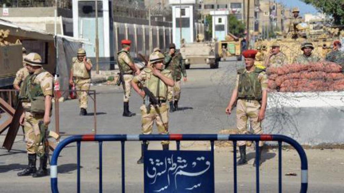 Egyptian soldiers stand guard in the Suez Canal city of Port Said on March 9, 2013. (File photo: AFP)