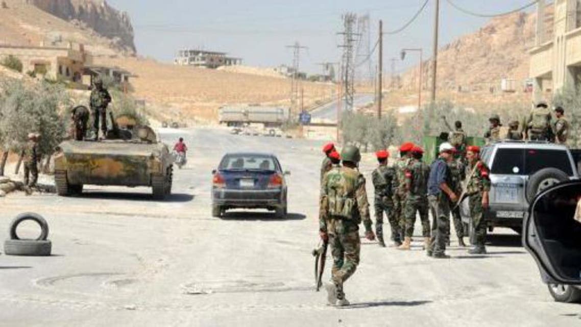 Syrian army forces are seen in the Christian town of Maalula on September 7, 2013 (AFP)
