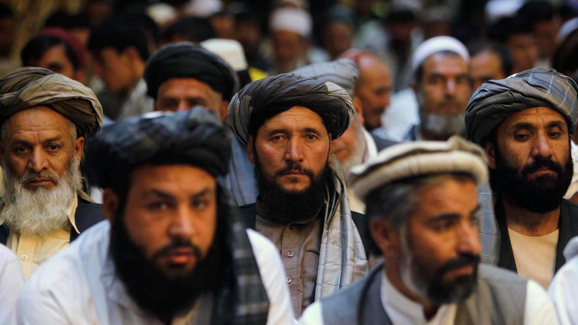 Afghan men attend a gathering launched by a political party ahead of an election campaign in Kabul September 3, 2013. reu