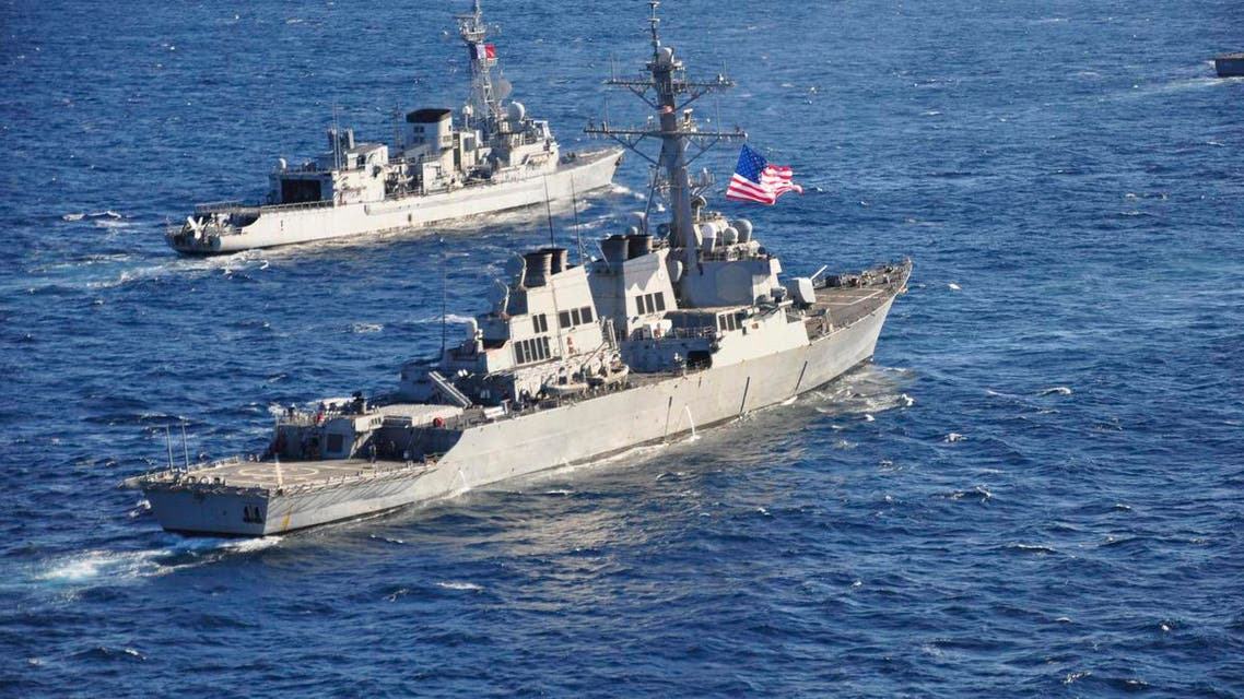 The guided-missile destroyer USS Barry (DDG 52), (front) pulls into formation with the French Marine Nationale anti-submarine frigate Jean de Vienne (D 643) during Exercise Proud Manta 2013 (POMA 13) in this February 26, 2013 handout photo provided by the U.S. Navy. (Reuters)