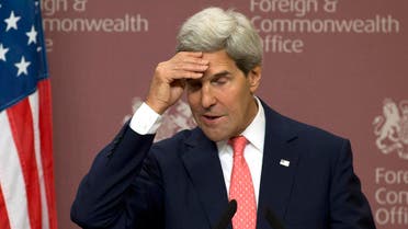 U.S. Secretary of State John Kerry reacts during his joint news conference with Britain's Foreign Secretary William Hague at the Foreign and Commonwealth Office in London September 9, 2013. reu