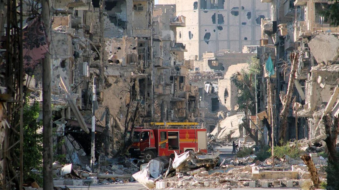 A picture shows a firetruck left amid heavily damaged buildings in the Syria's eastern town of Deir Ezzor on September 10, 2013. (AFP)