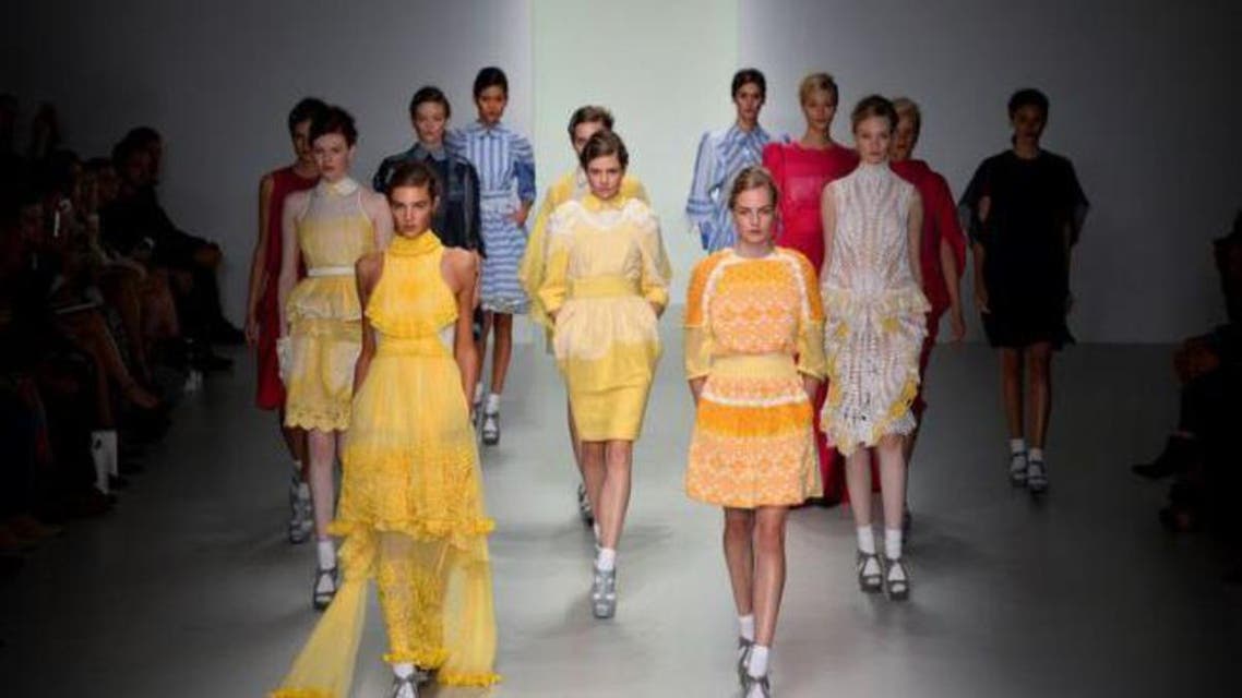 Models present creations by Bora Aksu during the 2014 Spring/Summer London Fashion Week in London on September 13, 2013. (AFP,