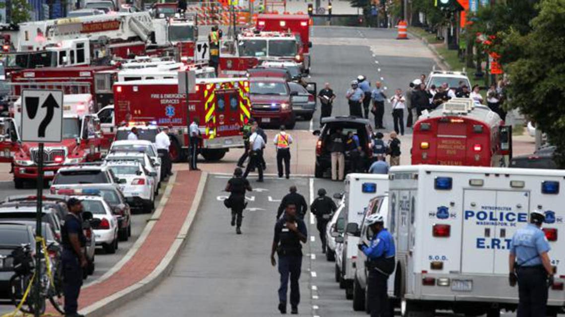 Emergency vehicles and law enforcement personnel respond to a reported shooting at an entrance to the Washington Navy Yard Sept. 16, 2013 in Washington, DC. (AFP)