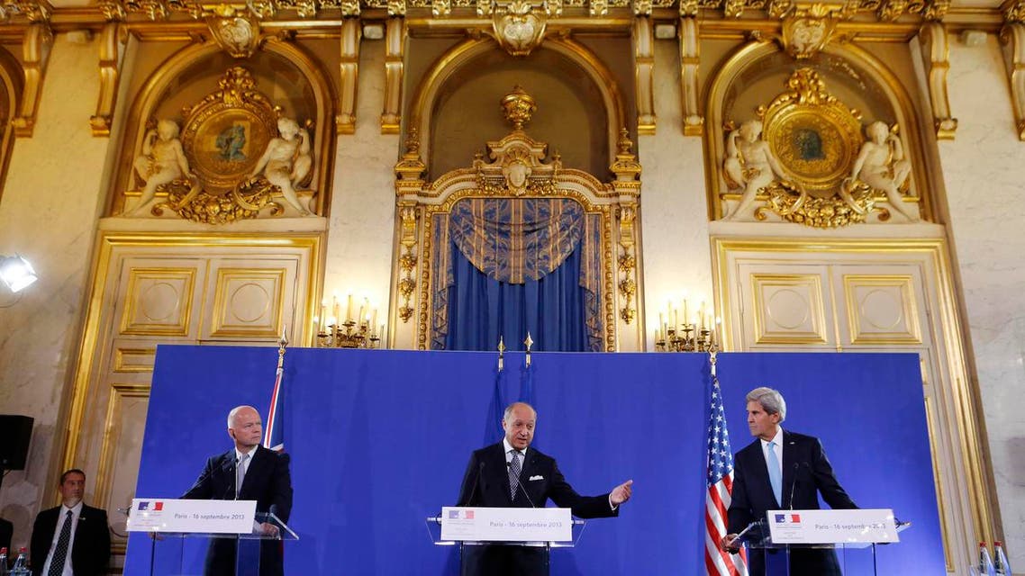 U.S. Secretary of State John Kerry (R) and British Foreign Secretary William Hague (L) listen to French Foreign Minister Laurent Fabius speak at a news conference after a meeting regarding Syria, at the Quai d'Orsay in Paris September 16, 2013. reu