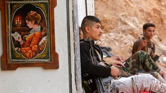 NGO: Syria troops, militia kill 15 in Sunni village 
