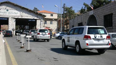 A convoy of United Nations vehicles is seen at the Lebanon-Syria Masnaa border crossing on October 1, 2013 afp
