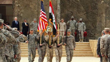 A flag-lowering ceremony is held to mark the end of U.S. forces mission in Iraq at an American base west of Baghdad,. (File Photo: AFP)